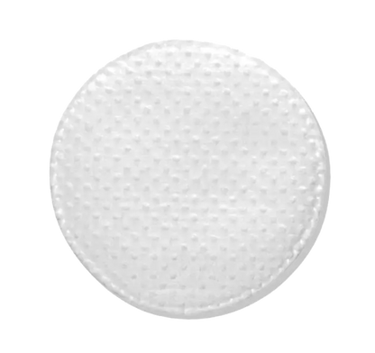 A close-up view of the pre-soaked Acne Control Pad, a round white object with a textured surface on a white background