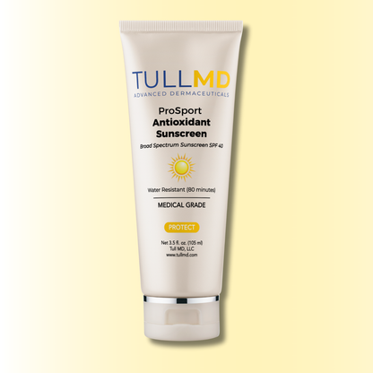 TullMD ProSport Antioxidant Sunscreen tube on a light yellow background