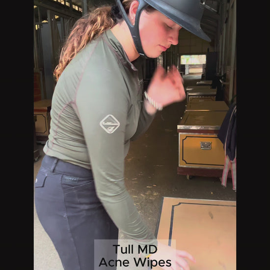 Rider uses Tull MD Acne Control Pads to clean forehead, face, and helmet after riding.